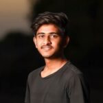 young handsome indian boy wearing black t shirt premium photo